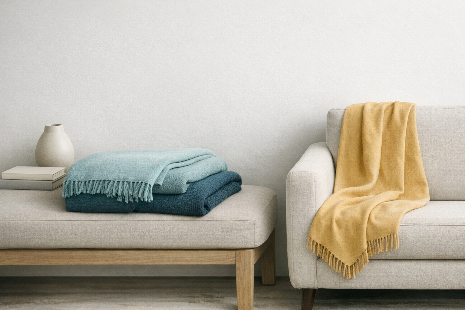A soft, nude-colored throw blanket draped over a chair.
